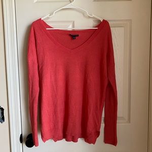 Coral v-neck sweater.